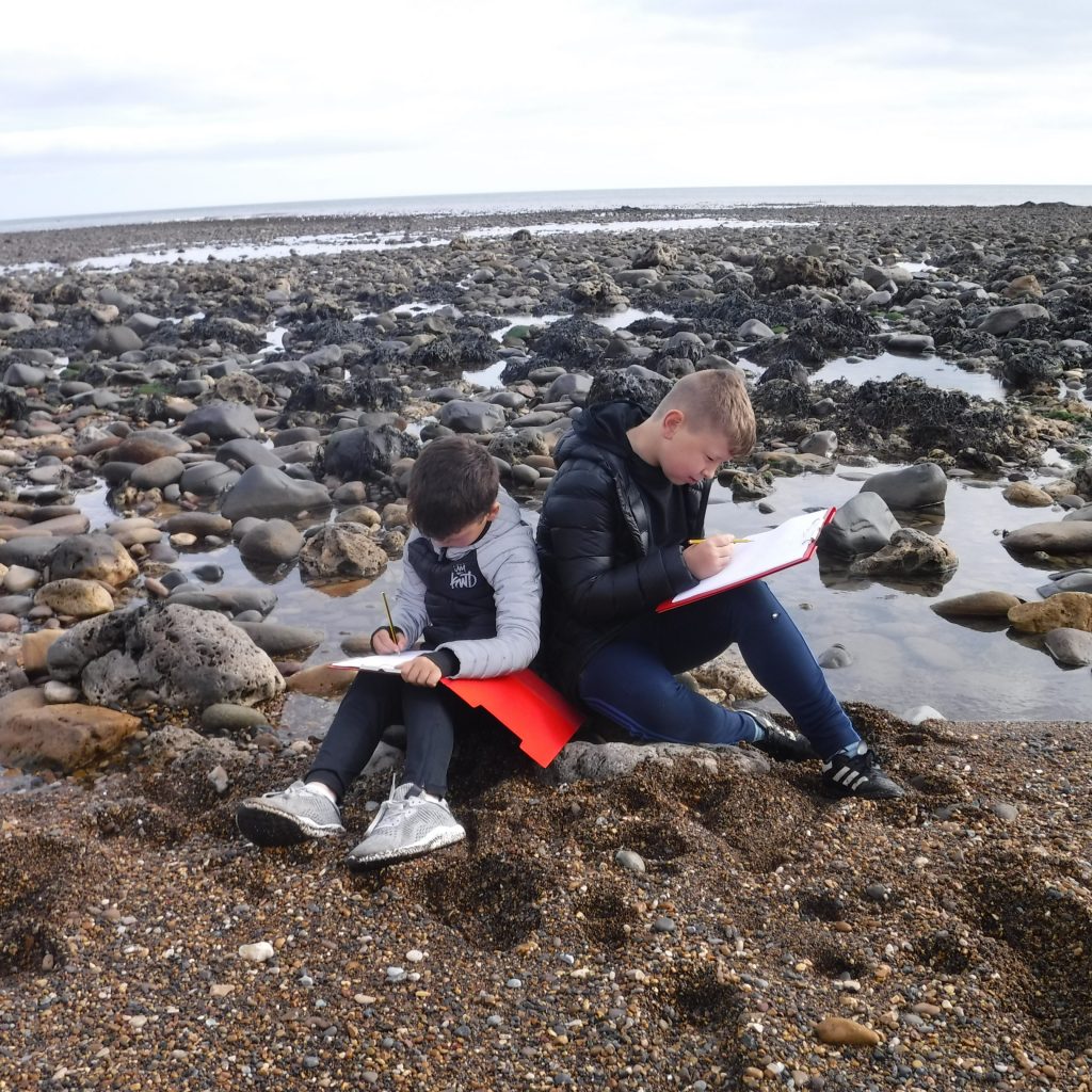 Children taking part in activities at the beach